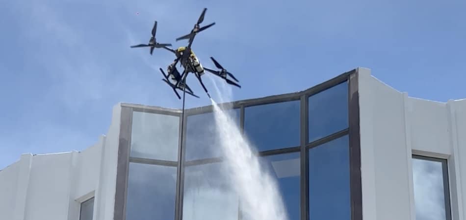 Drone Spraying Water for Bldg Upkeep